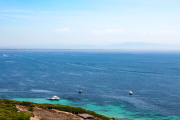 Blue water with yachts as a background from drone. Summer seascape