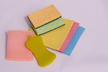 Colored sponges for cleaning dishes on a white background. Sponges for washing dishes