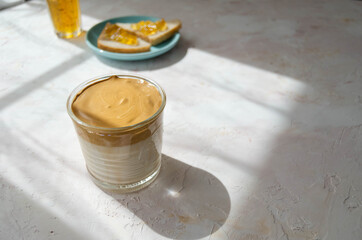 delicious Breakfast, coffee and slices of loaf with jam on a light background