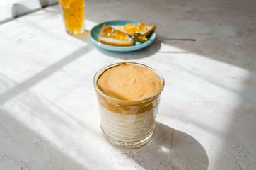 delicious Breakfast, coffee and slices of loaf with jam on a light background