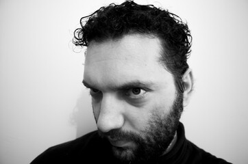 Close-up portrait of a handsome young man with brave manly face. Male beauty.