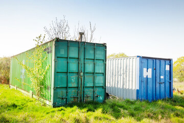 metal containers in a field