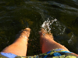bare feet splashing in the water 