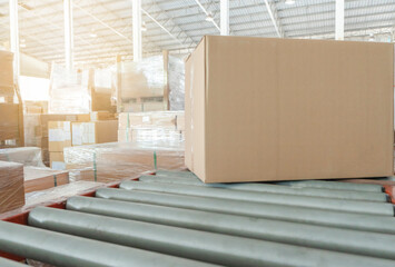 Cardboard boxes onconveyor belt at distribution warehouse. shipment boxes, eport and import