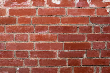 Obraz premium Fragment of a red brick wall, large brickwork