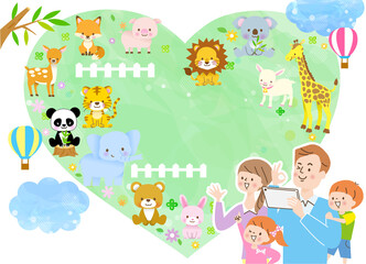 家族で動物園に遊びにきて仲良く記念撮影をしている様子/背景あり
