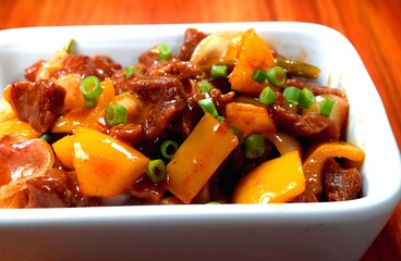Beef stew with potatoes and vegetables. Closeup view of delicious Chinese  chili beef . Chili beef Garnished with spring onion. 
