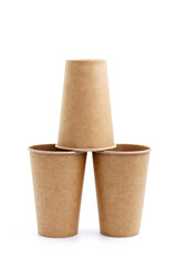 Three paper cups in the shape of a pyramid, isolated on white background.