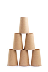 Six paper cups in the shape of a pyramid, isolated on a white background.