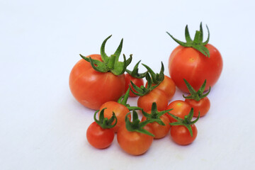 Red cherry tomatoes with white background