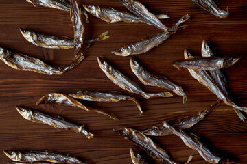 Dried smelt on a wooden table. 
