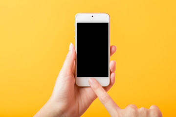woman Hand is holding Smart phone mockup on yellow background
