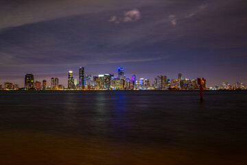 Miami, Florida, USA skyline on Biscayne Bay. Night in Miami. Skyscrapers against the night sky in...