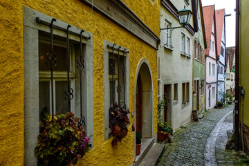 Narrow medieval street in old town Rothenburg ob der Tauber, Bavaria, Germany. November 2014