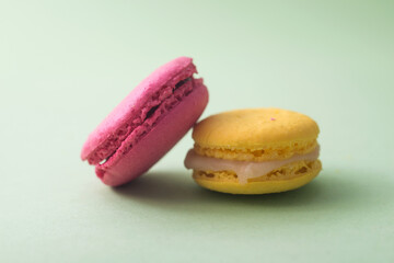 Closeup of french traditional macarons on green background