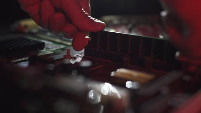 A closed plane assembling RAM module on a modern motherboard with environmental smoke