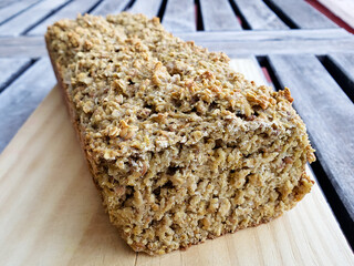 Healthy vegan oat, coconut loaf bread, cake on wooden tray