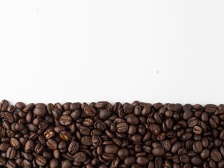 Roasted Brown Coffee Beans Isolated on white background For entering text.