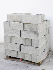 cement concrete blocks on wooden palettes