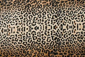 Selbstklebende Fototapeten Brown with black leopard print on soft fabric. Animal fur print as background. © Татьяна Григорьева