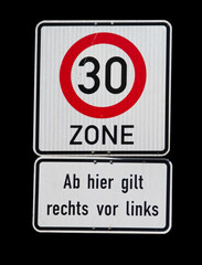 Isolated german sign with speed limit of 30 kilometer per hour and right has right-of-way sign