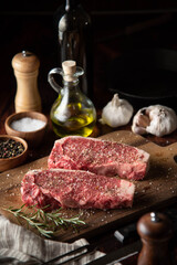 seasoned raw sirloin beef steak on cutting board