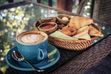 Coffee latte with croissant and bread