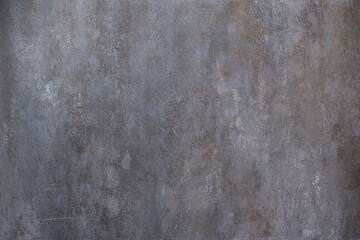 Dark grunge stone textured wall closeup