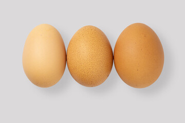three eggs on a white background