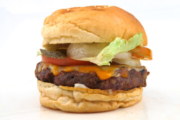hamburger with beef, cheese and fried potato on a white background