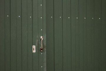 Opening green metal gate with handle