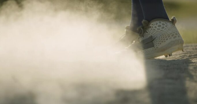 Pitcher kicking dustup on a mound. Baseball. Baseball pitcher kicking up dust on a pitchers mound. Shot in 4k.