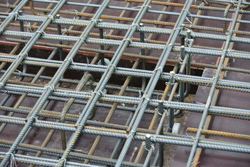 SELANGOR, MALAYSIA -MAY 18, 2016: Hot rolled deformed steel bars or steel reinforcement bar tied together before casting in the concrete. Its function is to increase the concrete strength. 
