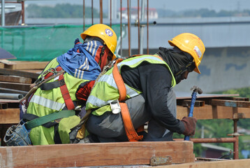 MALACCA, MALAYSIA -MAY 13, 2016: Construction workers working at the construction site at Malacca,...