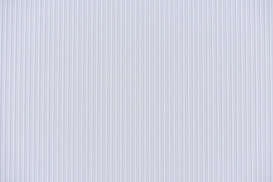 Background of corrugated colored paper. White paper texture background.