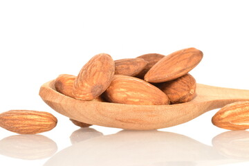 Roasted flavored almonds, close-up, on a white background.