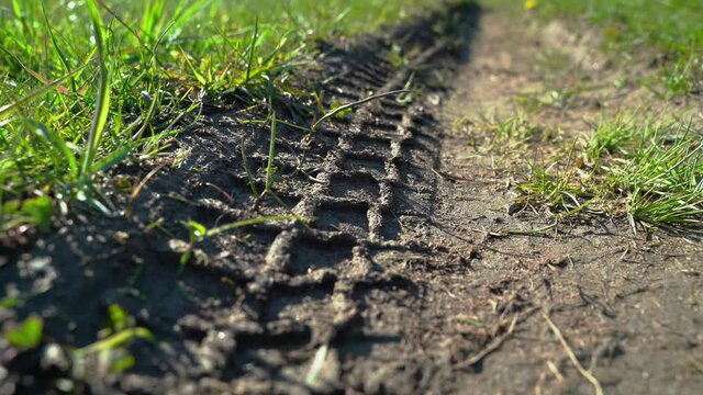 Traces of car on road. Tire print on gravel road. Imprint from the wheels