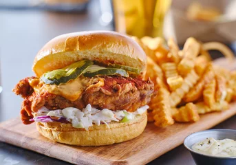 Foto auf Acrylglas spicy nashville hot chicken sandwich with coleslaw and pickles © Joshua Resnick