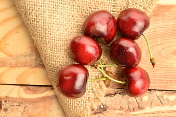 Ripe juicy organic sweet cherry, close-up, on a  wooden table.