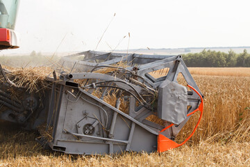 Combine harvester working in a very wide wheat field