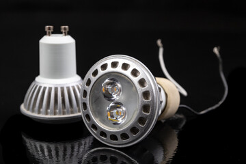 LED bulbs on a dark table. LED lighting and connectors for the energy source.