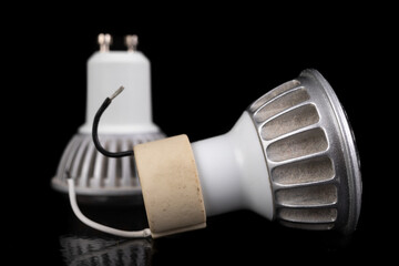 LED bulbs on a dark table. LED lighting and connectors for the energy source.