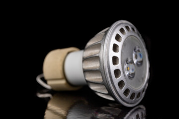 LED bulbs on a dark table. LED lighting and connectors for the energy source.