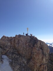 men on top of mountain