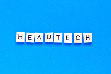 Obraz premium headtech lettering in wooden letters. People computer chip. Innovative technology. Digital modern communication. Manager.