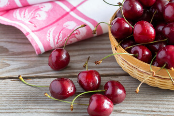Ripe bright cherry on a wooden table. Close-up.