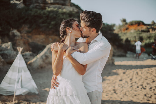 Wedding beach young couple sunset sand white happy sea waves
