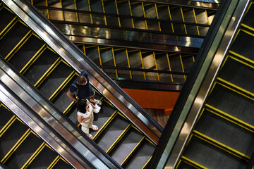 Masked people on escalators