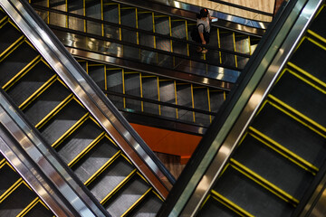 Masked people on escalators