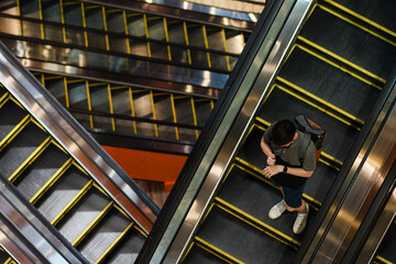 Masked people on escalators